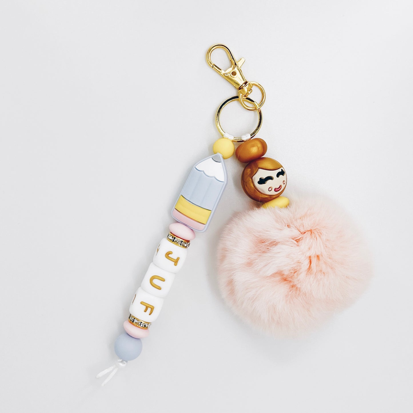 Sleutelhanger - juf - popje van geluk goud pastel met naam